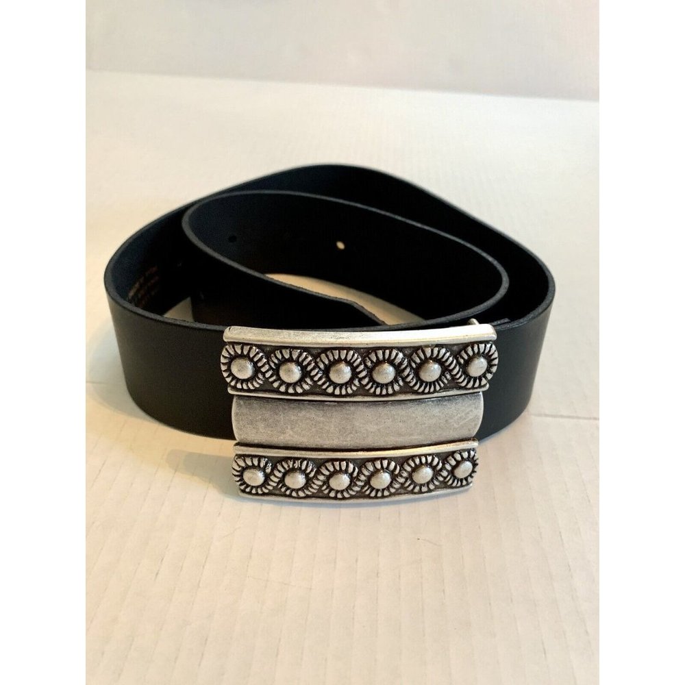 women’s black leather belt with silver embossed buckle made in Spain.